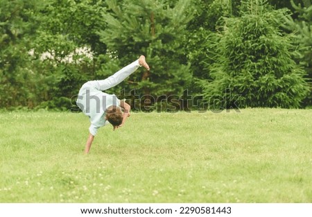 Similar – Image, Stock Photo Sportsman training on backyard and watching tutorial on laptop