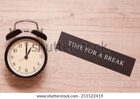 alarm clock showing one o\'clock and indicating it is time for a break