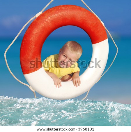 smiling boy in ring-buoy