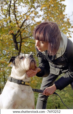 Young woman and strong dog