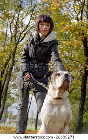 young woman and strong dog