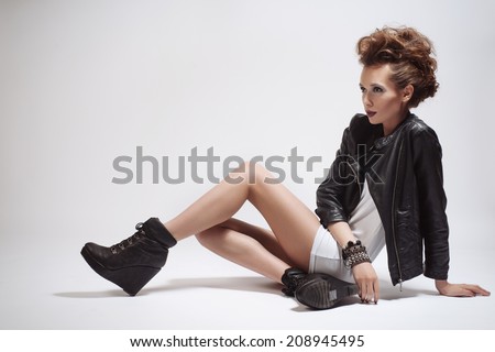 Fashion Rocker Style Model Girl Portrait. Hairstyle. Rocker or Punk Woman Makeup, Hairdo and Accessories