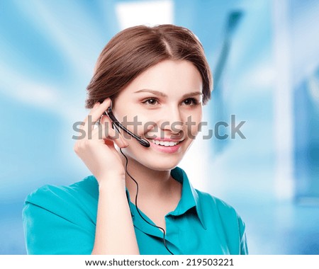 Portrait of happy smiling cheerful young support phone operator in headset showing copyspace area or something, isolated over white background
