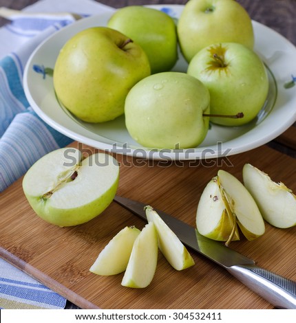 Group of green fresh apples. Apples cut into slices.