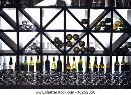 wine cabinet with bottles and glasses