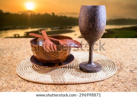 Coffee and drink  on the oak table with nature background. (wood cup)