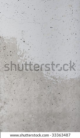A texture of Cement, half painted with a flat blue-grey