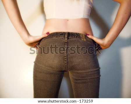 Female figure in jeans, back view