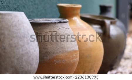Clay pots arranged in a row as a decoration, an ornament in the garden. Zdjęcia stock © 