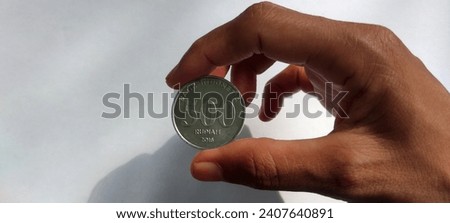 Similar – Image, Stock Photo hand holding 500 coins indonesian rupiah