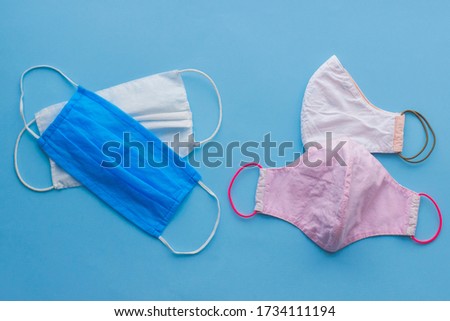 Similar – Image, Stock Photo blue single-use mask for virus protection on red background