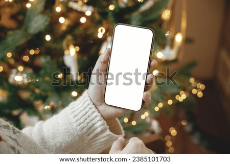 Similar – Image, Stock Photo Christmas concept background.Smartphone with santa claus hat and Christmas tree branches