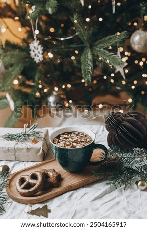 Similar – Image, Stock Photo Delicious fir tree with white chocolate, sugar pearls and red jam on dark plate in moody style