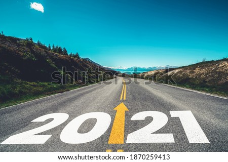 2021 New Year road trip travel and future vision concept . Nature landscape with highway road leading forward to happy new year celebration in the beginning of 2021 for fresh and successful start .
