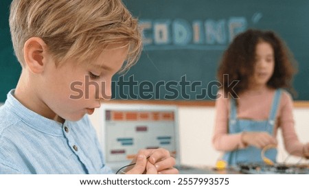 Similar – Image, Stock Photo Boy child using screwdriver at home