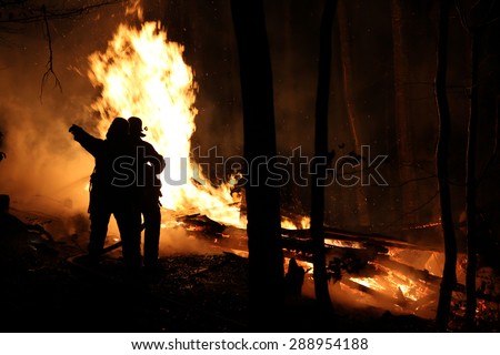 Fire fighters at a burning house