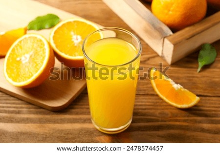 Similar – Image, Stock Photo A glass of orange juice with a straw and a palm leaf on a yellow background. Top view