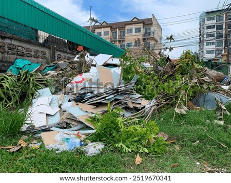 Similar – Image, Stock Photo Plastic waste in branches of a bare tree in front of a glass facade