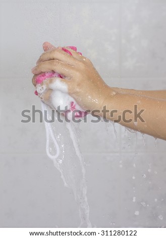 Use shower sponge to washing the hands in the bathroom No.2