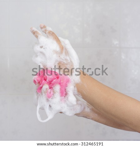 Use shower sponge to washing the hands in the bathroom No.4