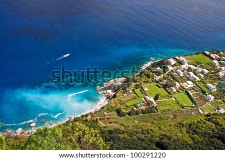 stock-photo-beautiful-coast-with-boat-on-capri-island-italy-100291220.jpg