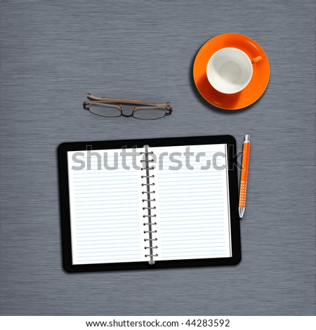 work desk with notebook, plain paper and coffeecup
