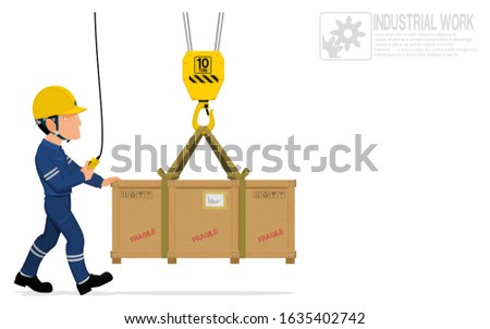 A worker is moving the  heavy wooden crate with crane
