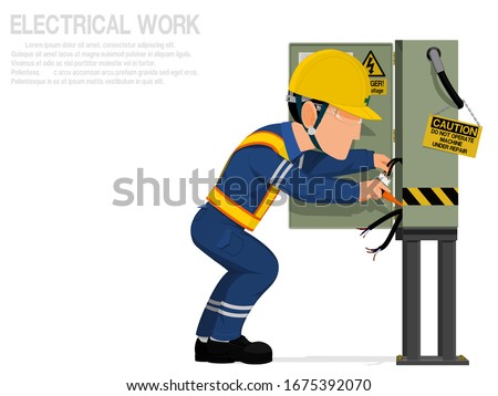 An electrician is repairing the electrical cabinet.
