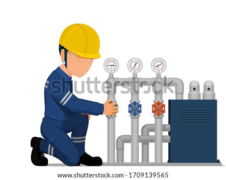 
An industrial worker is turning on the valve
