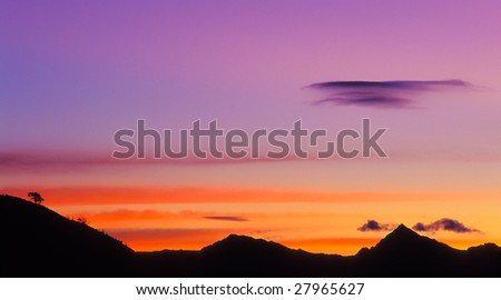 Mountain silhouette with beautiful colorful clouds
