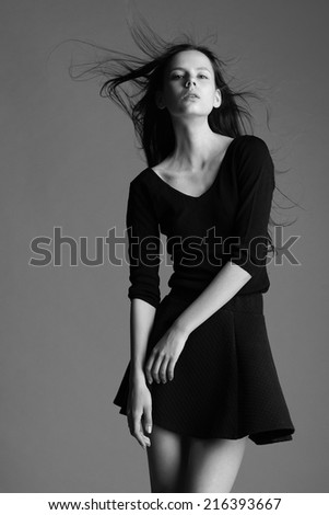 beautiful young model posing in the studio with different emotions. black and white photo.