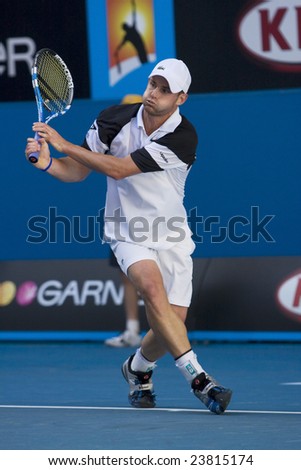 MELBOURNE - JANUARY 23: Andy Roddick of the USA returns a serve at the Australian Open Tennis Grand Slam Event on January 23, 2009 in Melbourne.