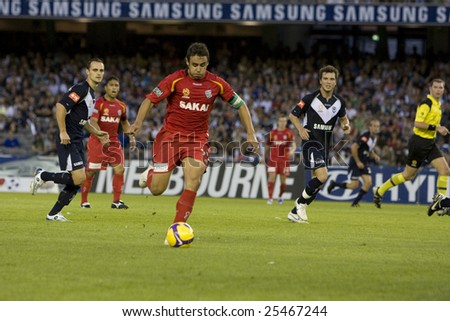 MELBOURNE - FEBRUARY 14: A-league Major Semi Final - Melbourne Victory 4 defeated Adelade United 0. Travis Dodd pushes forward.