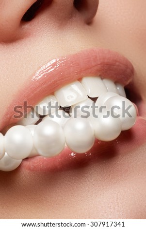 Beautiful smile of young fresh woman with great healthy white teeth and perls