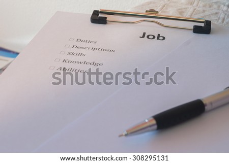Job description paper and pen