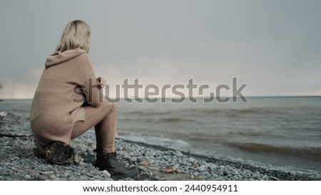 Similar – Image, Stock Photo Lonely woman admiring autumn landscape of lake and mountains