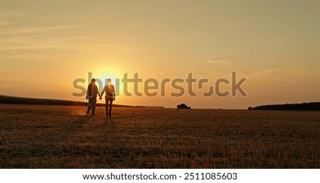 Similar – Image, Stock Photo Silhouettes pair walking through tunnel towards the sun