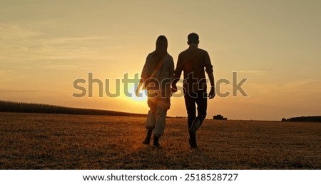 Similar – Image, Stock Photo Silhouettes pair walking through tunnel towards the sun