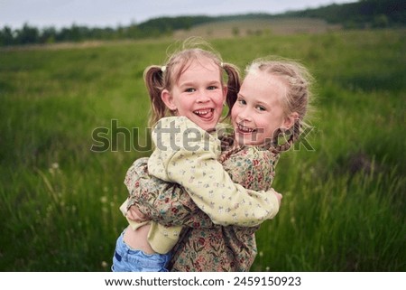 Similar – Image, Stock Photo Two girls and a child playing on the river