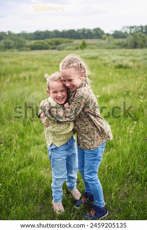 Similar – Image, Stock Photo Two girls and a child playing on the river