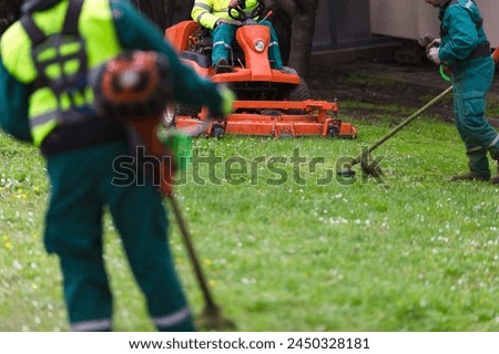 Similar – Foto Bild mit dem Rasenmäher den Rasen mähen