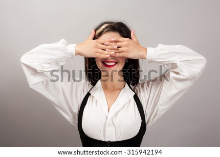brunette girl closed eyes with her hands