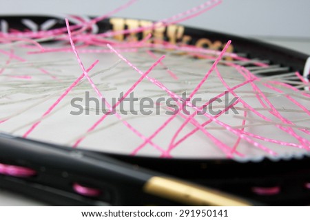 Broken pink tennis string