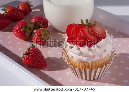 Cute strawberry cupcake and milk