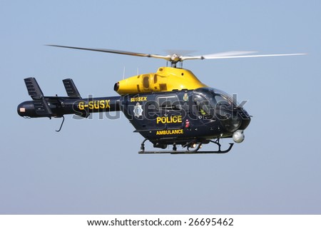SHOREHAM AIRPORT,SUSSEX - SEPTEMBER 31 : The Sussex police helicopter arrives at the Battle of Britain Airshow on September 31, 2008 in Shoreham Airport, Sussex, United Kingdom.