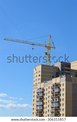 Crane near the newly built block of flats