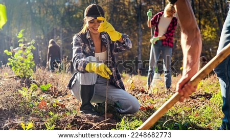 Similar – Image, Stock Photo Eco activists man and child on background of power stations for renewable electric energy production. People and windmills. Wind turbines for generation electricity. Green energy