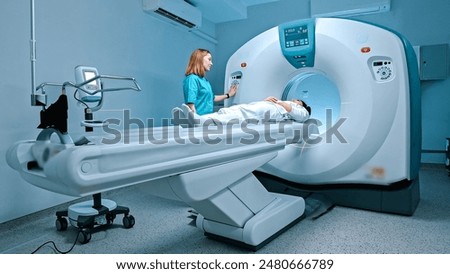 Similar – Foto Bild Radiologe und Patient am Tomographiegerät in der Klinik