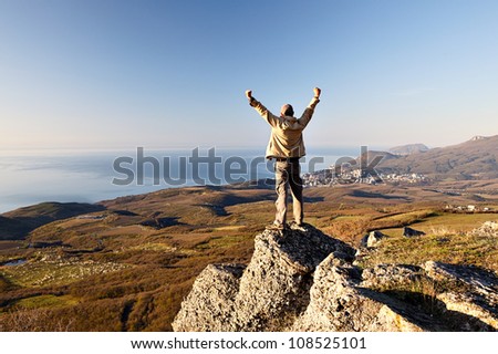 Man on the top of the mountain