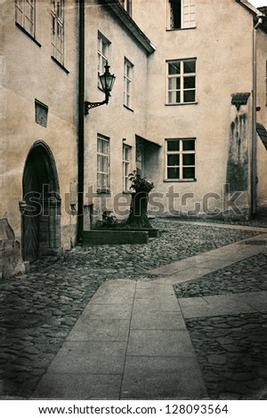Retro style photo of typical european old town street